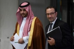 Saudi Deputy Defense Minister Prince Khalid bin Salman, left, walks with David Schenker, Assistant Secretary of Near Eastern Affairs, as he leaves the State Department in Washington, Aug. 28, 2019.