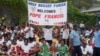 Peopel wait for the arrival of Pope Francis outside the Port Moresby International airport on Sept. 6, 2024.