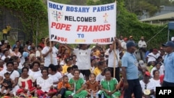 Peopel wait for the arrival of Pope Francis outside the Port Moresby International airport on Sept. 6, 2024.