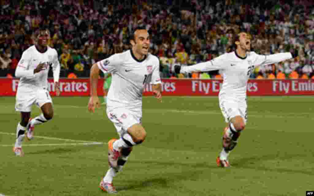 United States' Landon Donovan, center, celebrates after scoring a goal with fellow team members Benny Feilhaber, right, and Edson Buddle, left, during the World Cup group C soccer match between the United States and Algeria at the Loftus Versfeld Stadium 