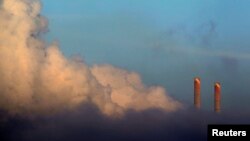 FILE - Vapor rises from Liddell Power Station near Muswellbrook, 170 km (106 miles) north of Sydney, Nov. 2, 2011.