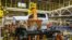 Robots swing a cab and bed into place for a new heavy duty pickup truck on the assembly line where Chevrolet Silverado trucks are being built at General Motors Flint Assembly in Flint, Michigan, Jan. 30, 2019. 