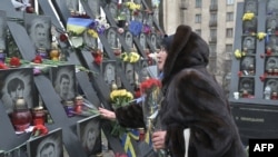 Українці вшановують пам'ять Небесної Сотні, 20 лютого 2024. Photo by Genya SAVILOV / AFP