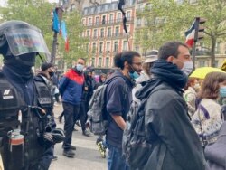 Police keep order at Worker Day demonstrations in Paris, where they were booed, May 1, 2021. (Lisa Bryant/VOA)