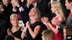 Carryn Owens, widow of Navy SEAL William “Ryan” Owens, is applauded on Capitol Hill in Washington, Feb. 28, 2017, as she was acknowledged by President Donald Trump during his address before a joint session of Congress. 