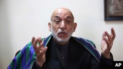 Former Afghan President Hamid Karzai speaks during an interview with the Associated Press in Kabul, Afghanistan, April 17, 2017. 