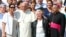 Pope Francis poses with Archbishop of Rouen Dominique Lebrun (R), Roselyne and Chantal Hamel, sisters of Father Jacques Hamel, at the end of his weekly audience at the Vatican, Sept. 14, 2016. 