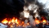 Flames rise from burning cars at the site of a car bomb in Beirut&#39;s southern suburb of Haret Hreik, Jan. 2, 2014. A large car bomb killed five people and injured at least 20, a health ministry source told AFP.