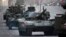 Russian military vehicles including the new Russian T-14 Armata tank, center, make their way to Red Square during a rehearsal for the Victory Day military parade which will take place on May 9 to celebrate 70 years after the victory in WWII, in Moscow, May 4, 2015.