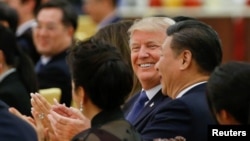 U.S. President Donald Trump and China's President Xi Jinping attend a state dinner at the Great Hall of the People in Beijing, China, Nov. 9, 2017. 