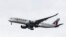 FILE - A Qatar Airways jet approaches Philadelphia International Airport in Philadelphia.