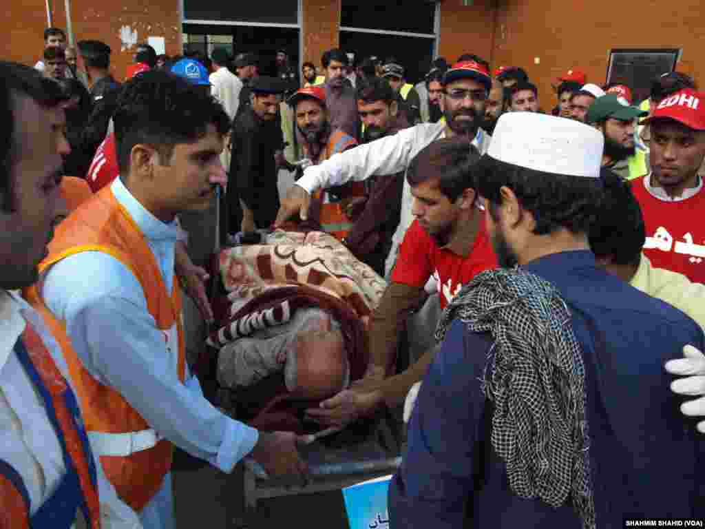Rescue workers attend to a man injured during the 7.5-magnitude earthquake Monday at the hospital in Peshawar, Pakistan, Oct. 26, 2015.&nbsp; 
