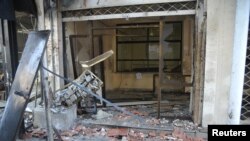 A view shows wreckage after Syrian rebels attacked a security compound at Bab Musalla area in Damascus, June 23, 2013, in this handout photograph released by Syria's national news agency SANA. 