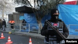 FILE - Turkish police stand guard outside the Reina nightclub by the Bosphorus, which was attacked by a gunman, in Istanbul, Turkey, Jan. 1, 2017. 