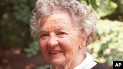 FILE - Author Lillian Ross enjoys the morning sun in New York's Central Park, June 10, 1997.