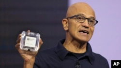 Microsoft CEO Satya Nadella introduces the Azure Boost DPU at the company's Ignite conference Tuesday, Nov. 19, 2024, in Chicago. (AP Photo/Charles Rex Arbogast)