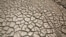 Cracked ground is pictured at the dried Ajuan Khota dam, a water reserve affected by drought near La Paz, Bolivia, Nov. 17, 2016.