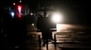 A Cuban rides a bike on a street at night during a nationwide blackout caused by a grid failure in Havana on December 4, 2024.