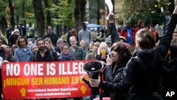 Protester Phoenix Singer (second from right) leads a chant before he and others march through the streets in Portland, Oregon, Nov. 16, 2016. Approximately 100 students at Portland State University joined a nationwide campus walkout to protest President-elect Donald Trump. 