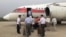 FILE - Passengers board an Air Koryo flight headed for Beijing in Pyongyang, North Korea, June 27, 2016. Air Koryo runs at least one gas station and car wash in Pyongyang, has its own fleet of taxis and operates several retail shops, including a boutique at the airport. 
