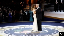 President Donald J. Trump dances with first lady Melania Trump at The Salute To Our Armed Services Inaugural Ball, Jan. 20, 2017, in Washington. 