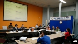 The Broward County Supervisor of Elections Canvasing Board reviews ballots cast in the U.S. midterm election, in Lauderhill, Florida, Nov. 9, 2018.