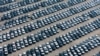 Electric (EVs) and hybrid vehicles wait to be transported in a distribution center of Chinese state-owned automobile manufacturer Changan in southwest China's Chongqing municipality, Jan. 12, 2025.