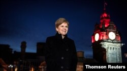 FILE - Scotland's First Minister Nicola Sturgeon poses for a picture at the new headquarters of Scottish National Investment Bank in Edinburgh, Scotland, November 19, 2020.