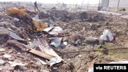 FILE - General view of the debris of the Ukrainian plane that was shot down on the outskirts of Tehran, Jan. 8, 2020. (Screen grab obtained from a social media video via Reuters).