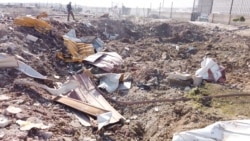 General view of the debris of the Ukraine International Airlines, flight PS752, Boeing 737-800 plane that crashed after take-off from Iran's Imam Khomeini airport, on the outskirts of Tehran, Iran January 8, 2020 is seen in this screen grab obtained…