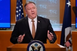 FILE - Secretary of State Mike Pompeo holds a news conference at the State Department on March 25, 2020.