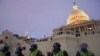 FILE - Police form a line to guard the Capitol after rioters stormed the Capitol, in Washington, Jan. 6, 2021.