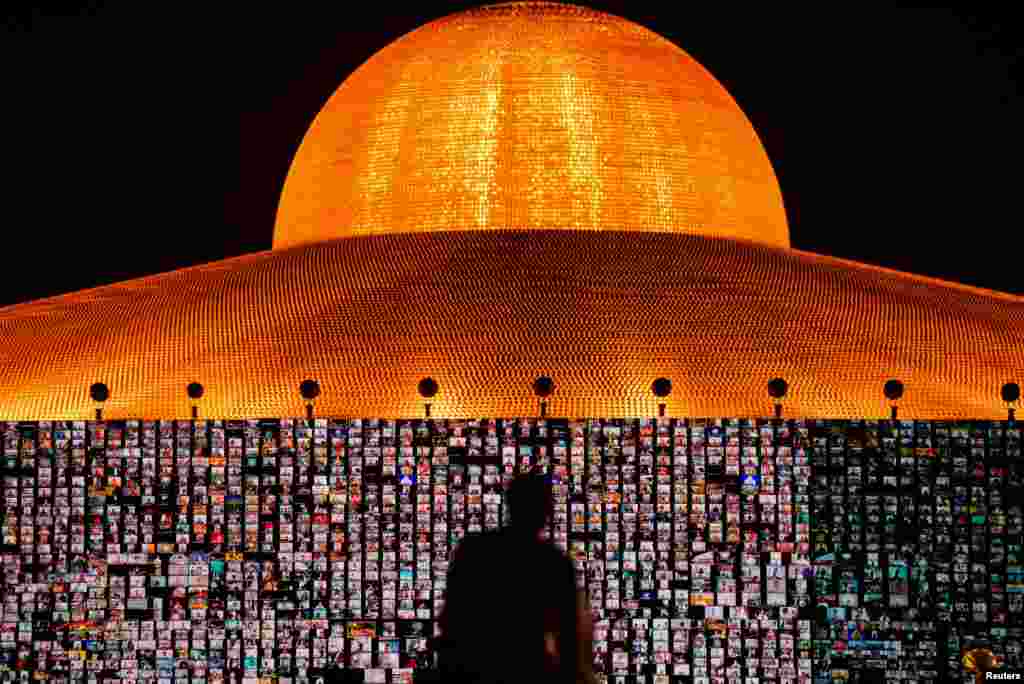 Devotees gather via Zoom application to pray during a ceremony to commemorate the Buddhist Lent Day at the Wat Phra Dhammakaya temple, amid the COVID-19 outbreaks, in Pathum Thani province, Thailand, July 24, 2021.