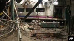 FILE - This photo provided by the National Transportation Safety Board on Oct. 1, 2016, shows damage done to the Hoboken Terminal in Hoboken, N.J., after a commuter train crash. 