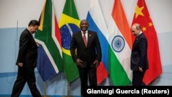 South Africa's President Cyril Ramaphosa, China's President Xi Jinping and Russia's President Vladimir Putin, at the BRICS summit meeting in Johannesburg, South Africa, July 26, 2018. (Gianluigi Guercia/Reuters)