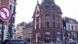 A Peugeot building in downtown Montbeliard in eastern France, once a key jobs supplier. (Lisa Bryant/VOA)