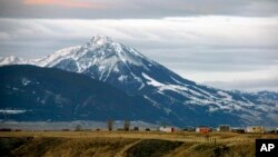 FILE - Emigrant Peak towers over the Paradise Valley in Montana north of Yellowstone National Park, Nov. 21, 2016. 