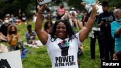 People celebrate Juneteenth at St. Nicholas Park, which commemorates the end of slavery in Texas, two years after the 1863 Emancipation Proclamation freed slaves elsewhere in the United States, in New York City, New York, June 18, 2021.