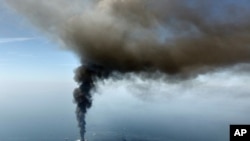 FILE - The Deepwater Horizon oil rig burns in the Gulf of Mexico,April 21, 2010. 