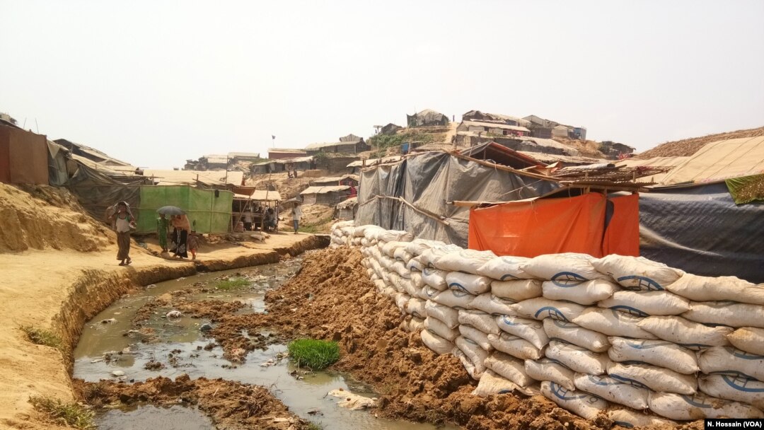 Sandbags have been placed at the edge of a cluster of shacks in Balukhali camp, Cox's Bazar, to prevent the shacks from being washed away during monsoon floods. 