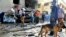 Egyptian security personnel and residents check the site of an explosion in Ismailia city, around 120 km, east of Cairo, Oct. 19, 2013. 
