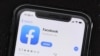 FILE - The social media application, Facebook is displayed on Apple's App Store, July 30, 2019. Facebook is launching a long-promised tool that lets users block the social network from gathering information about them on outside websites and apps.