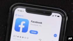 FILE - The Facebook social media app is displayed on an Apple's App Store, July 30, 2019. 