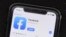 FILE - The Facebook social media app is displayed on an Apple's App Store, July 30, 2019. 