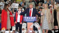 Republican presidential candidate Donald Trump, middle, speaks near his wife, Melania, left, son Baron, daughter Ivanka, second from right, and daughter Tiffany during a campaign event at the Myrtle Beach Convention Center on Nov. 24, 2015, in Myrtle Beac