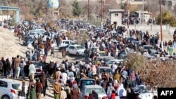 Afghan men leave after watching the public execution of a man by the Taliban at a football stadium in Gardez, in Paktia province, Nov. 13, 2024.