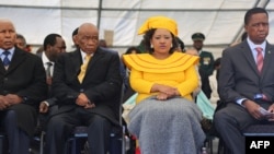 FILE - Newly-appointed Lesotho prime Minister Thomas Thabane (L), his wife Maesaiah Thabane and Zambian President Edgar Lungu (R) attend Thabane's inauguration on June 16, 2017 in Maseru.