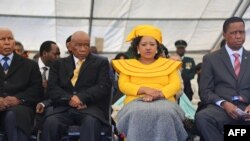 FILE - Newly-appointed Lesotho prime Minister Thomas Thabane (L), his wife Maesaiah Thabane and Zambian President Edgar Lungu (R) attend Thabane's inauguration on June 16, 2017 in Maseru.