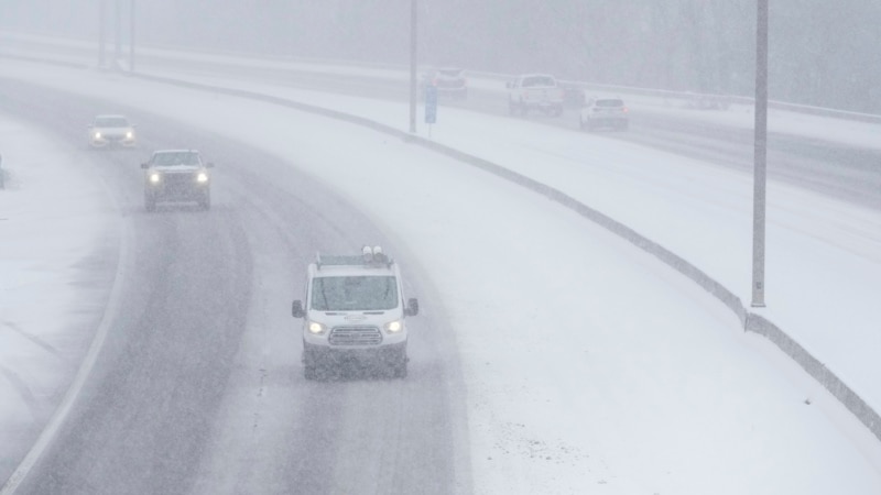 Snowstorm ices roads, closes schools, delays flights in southern US