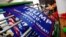 FILE - Flags for U.S. President Donald Trump's "Keep America Great!" 2020 re-election campaign are seen at Jiahao flag factory in Fuyang, Anhui province, China July 24, 2018.